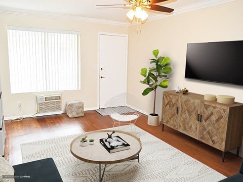 a living room with a tv and a table